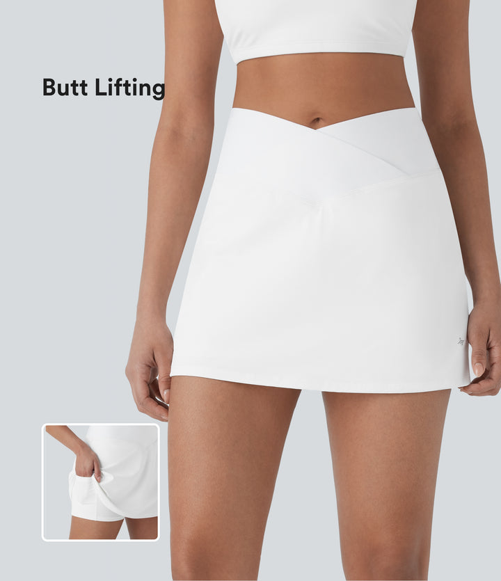 QuickDry Crossover High Waisted Tummy Control Built-in Butt Lifting Shorts A-line Mini Tennis Skirt with Pockets — White — view 1