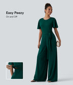 Round Neck Short Sleeve Tie Front Wide Leg Jumpsuit with Pockets-Edition — Rain Forest — view 1