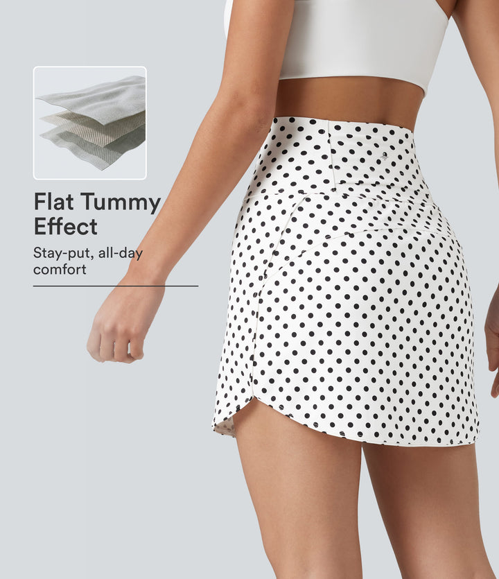 Ultra High-Waist Tummy Control Curved Hem 2-in-1 Polka Dot Golf Mini Skirt with Pockets — Snow Dots — view 1