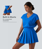 V-neck Invisible Zipper Short Sleeve Pleated Hem 2-in-1 Mini Tennis Active Dress with Pockets — Pure Tile Blue — view 1