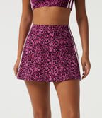 High Waisted Tummy Control A-Line Side Stripe Leopard Print Workout Mini Skirt with Built-in Shorts and Pockets — Black and Fuchsia Leopard Print — view 3
